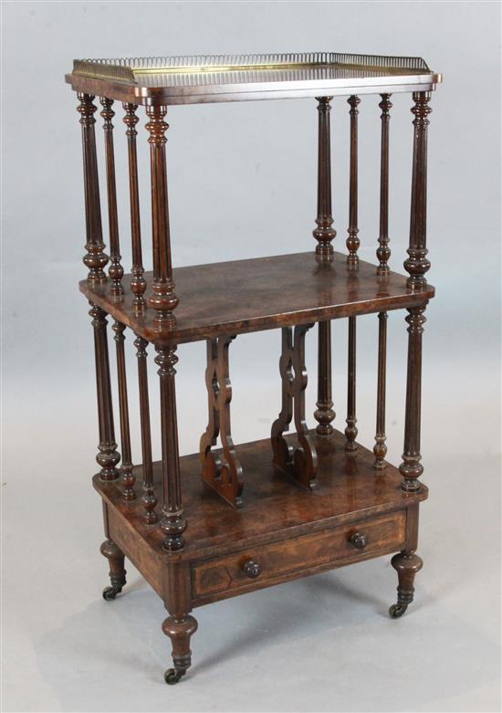 A Victorian figured walnut three tier whatnot, W.1ft 10in. D.1ft 4in. H.3ft 7in.